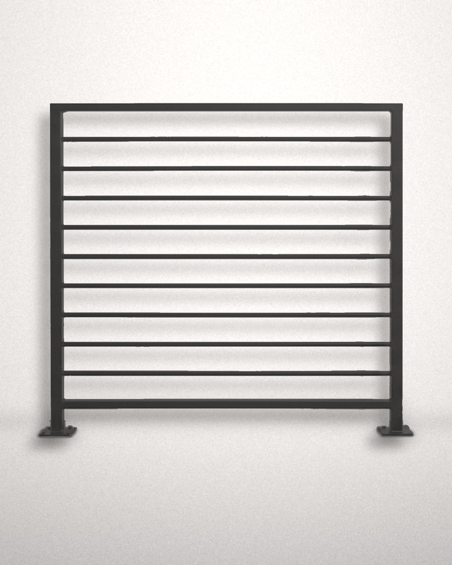 Horizon horizontal bar railing panel in matte black powder coated steel standing against a plain wall — welded guardrail with evenly spaced horizontal bars and bolt-down base plates, custom made to size in New Jersey