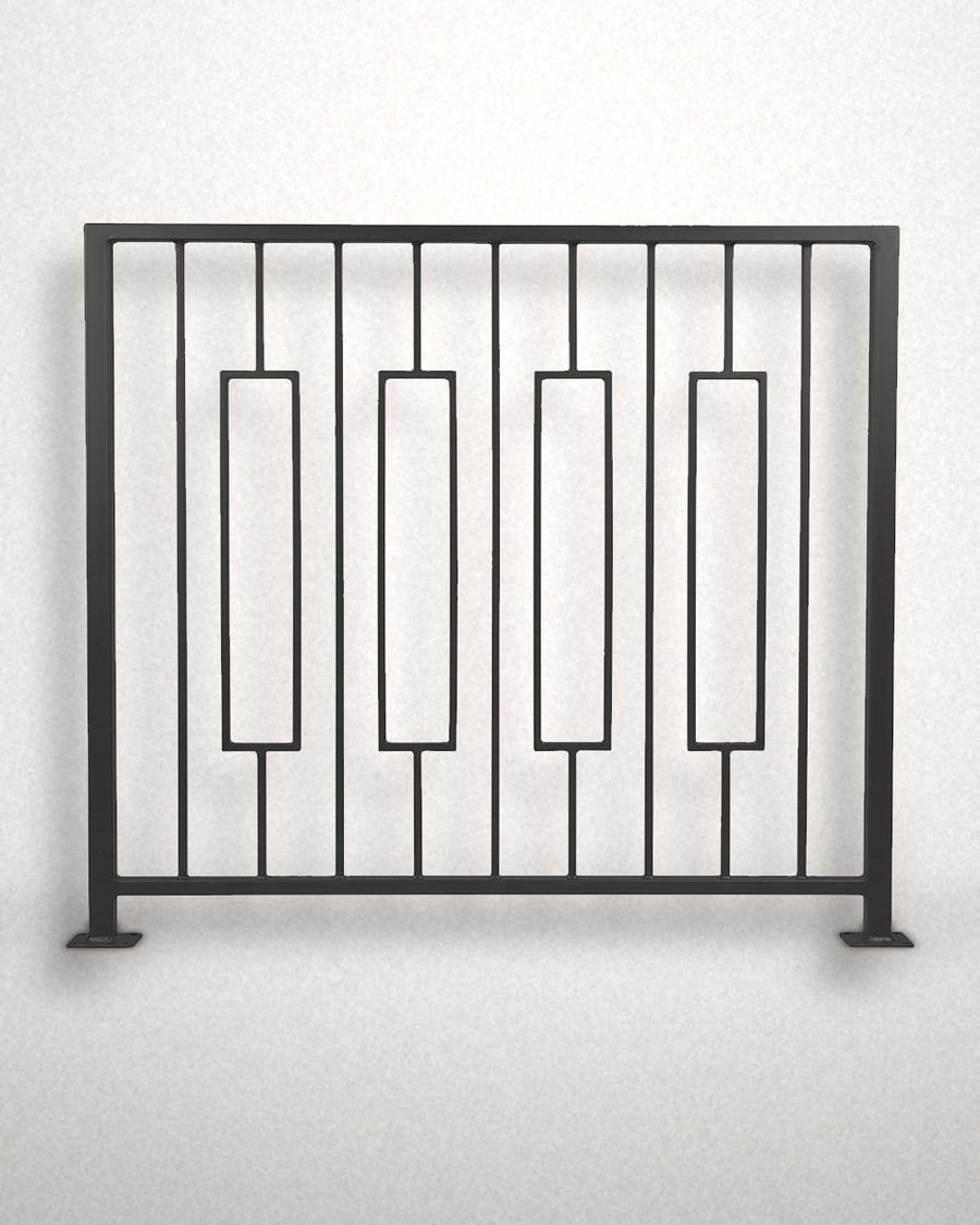Keystone framed railing panel in matte black powder coated steel standing against a plain wall — four floating rectangular frames between vertical bars, custom welded guardrail made to size in New Jersey