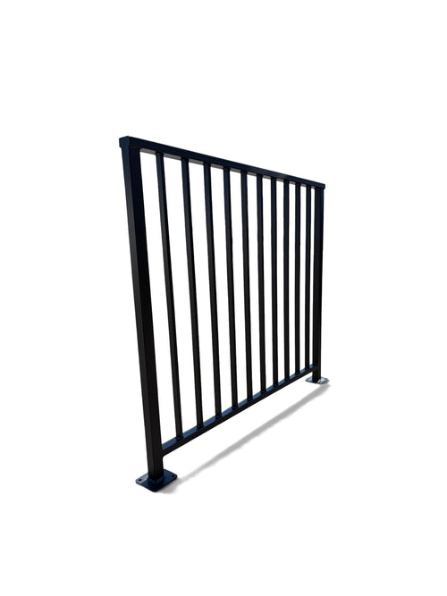 Axis vertical bar steel railing panel at an angle — matte black powder coated guardrail showing post depth and flat cap rail, custom made to size