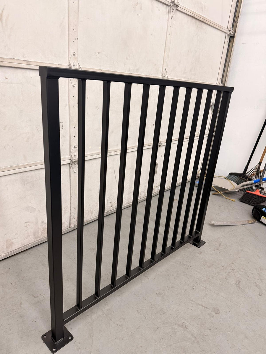 Finished Axis vertical bar guardrail panel standing in the Barzel fabrication shop in Jackson, New Jersey before delivery