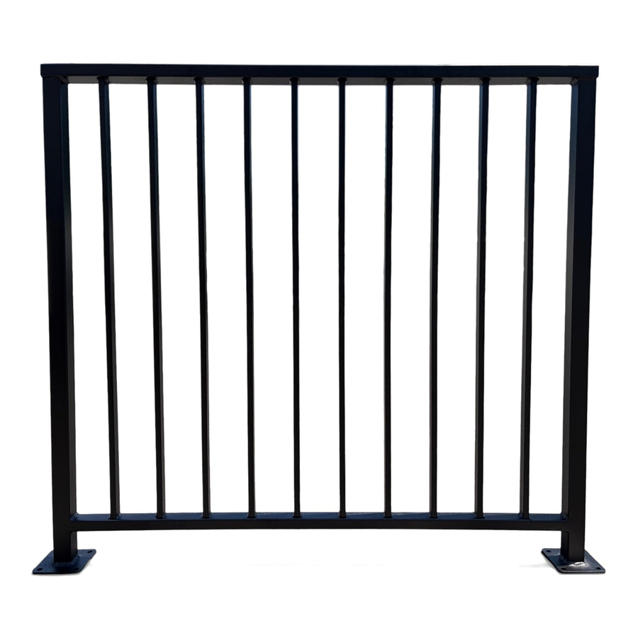 Axis vertical bar railing panel in matte black powder coated steel — custom welded guardrail with flat top cap rail and bolt-down base plates, made to size in New Jersey