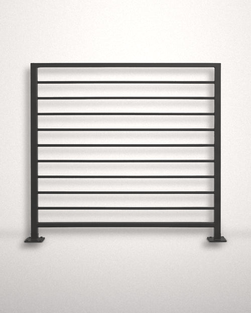 Horizon horizontal bar railing panel in matte black powder coated steel standing against a plain wall — welded guardrail with evenly spaced horizontal bars and bolt-down base plates, custom made to size in New Jersey