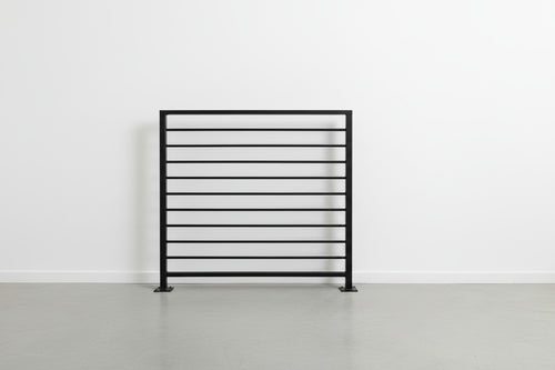 Horizon horizontal bar railing panel in matte black powder coated steel — welded guardrail with evenly spaced horizontal bars and bolt-down base plates, custom made to size in New Jersey