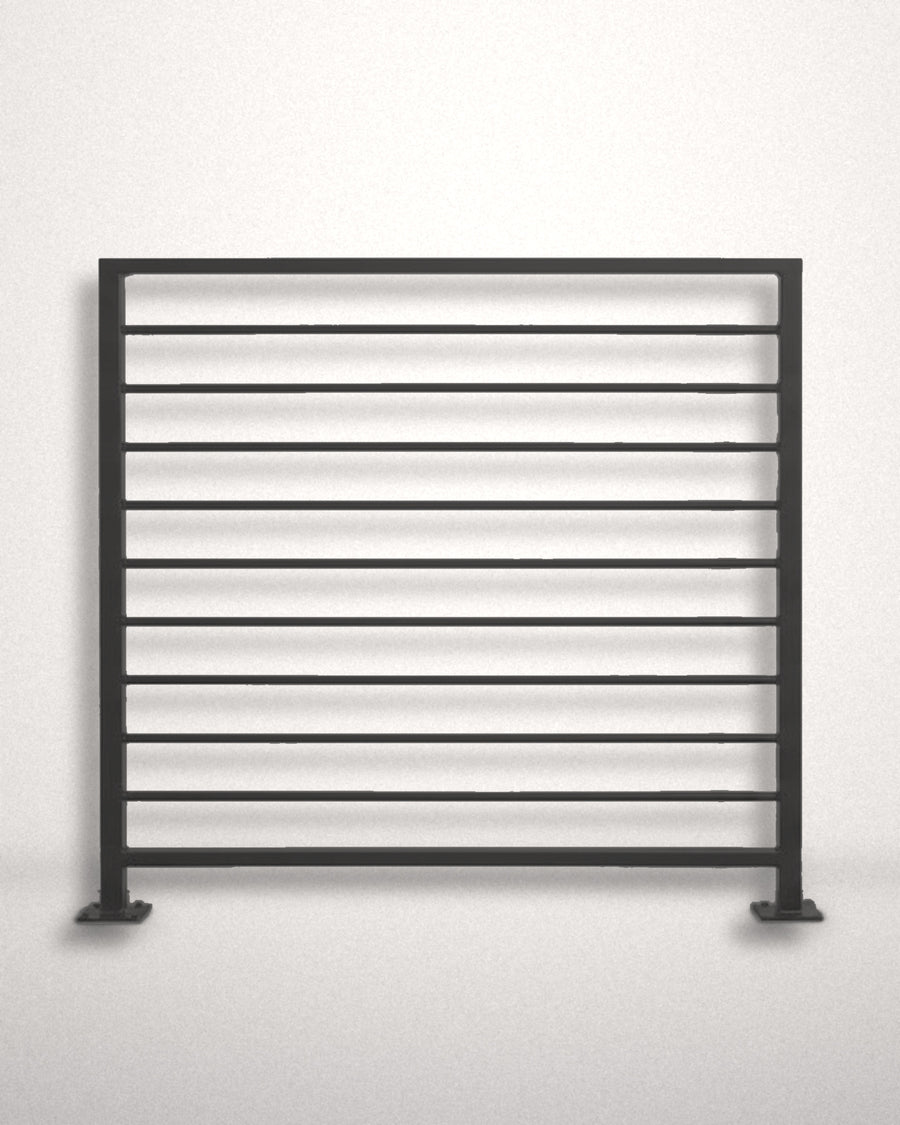 Horizon horizontal bar railing panel in matte black powder coated steel standing against a plain wall — welded guardrail with evenly spaced horizontal bars and bolt-down base plates, custom made to size in New Jersey