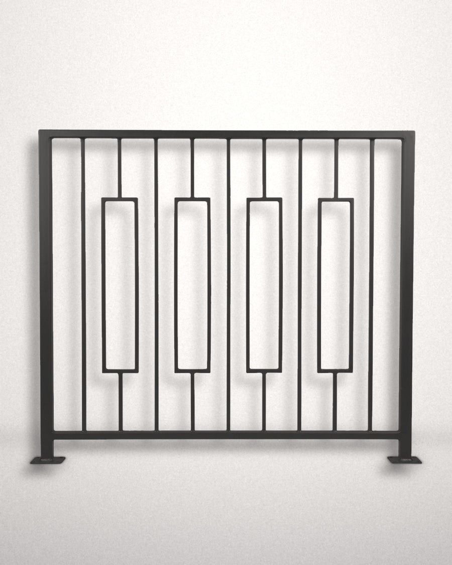 Keystone framed railing panel in matte black powder coated steel standing against a plain wall — four floating rectangular frames between vertical bars, custom welded guardrail made to size in New Jersey